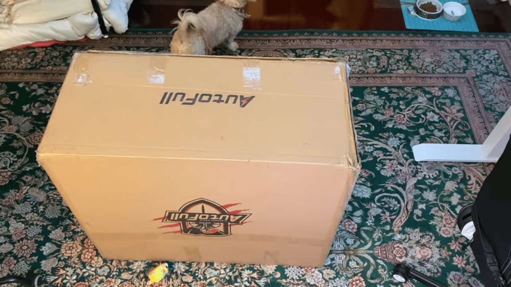 view of autofull gaming chair unboxing purchased package arrival at home