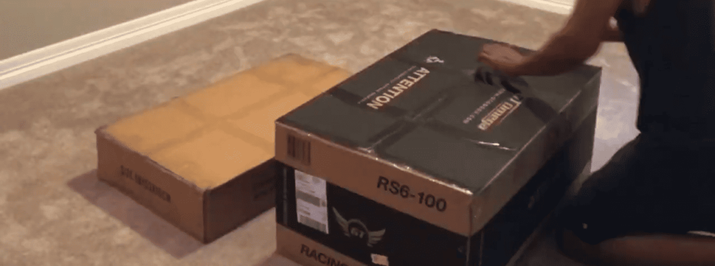 view of gt omega rs6 gaming seat and frame unboxing purchased package arrival home