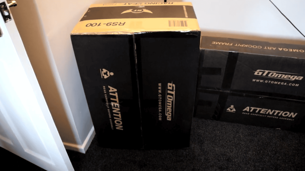 view of gt omega rs9 gaming seat and frame unboxing purchased package arrival home
