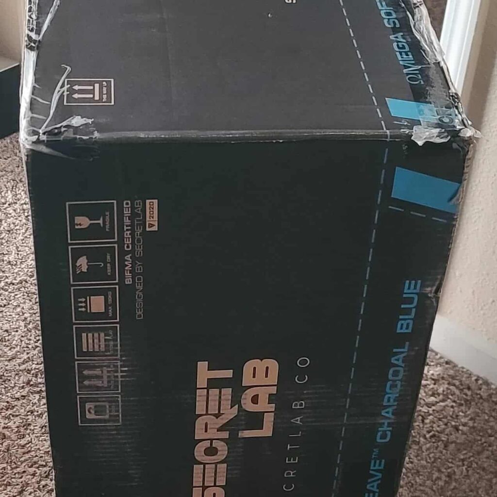 view of secret lab omega gaming chair unboxing purchased package arrival at home