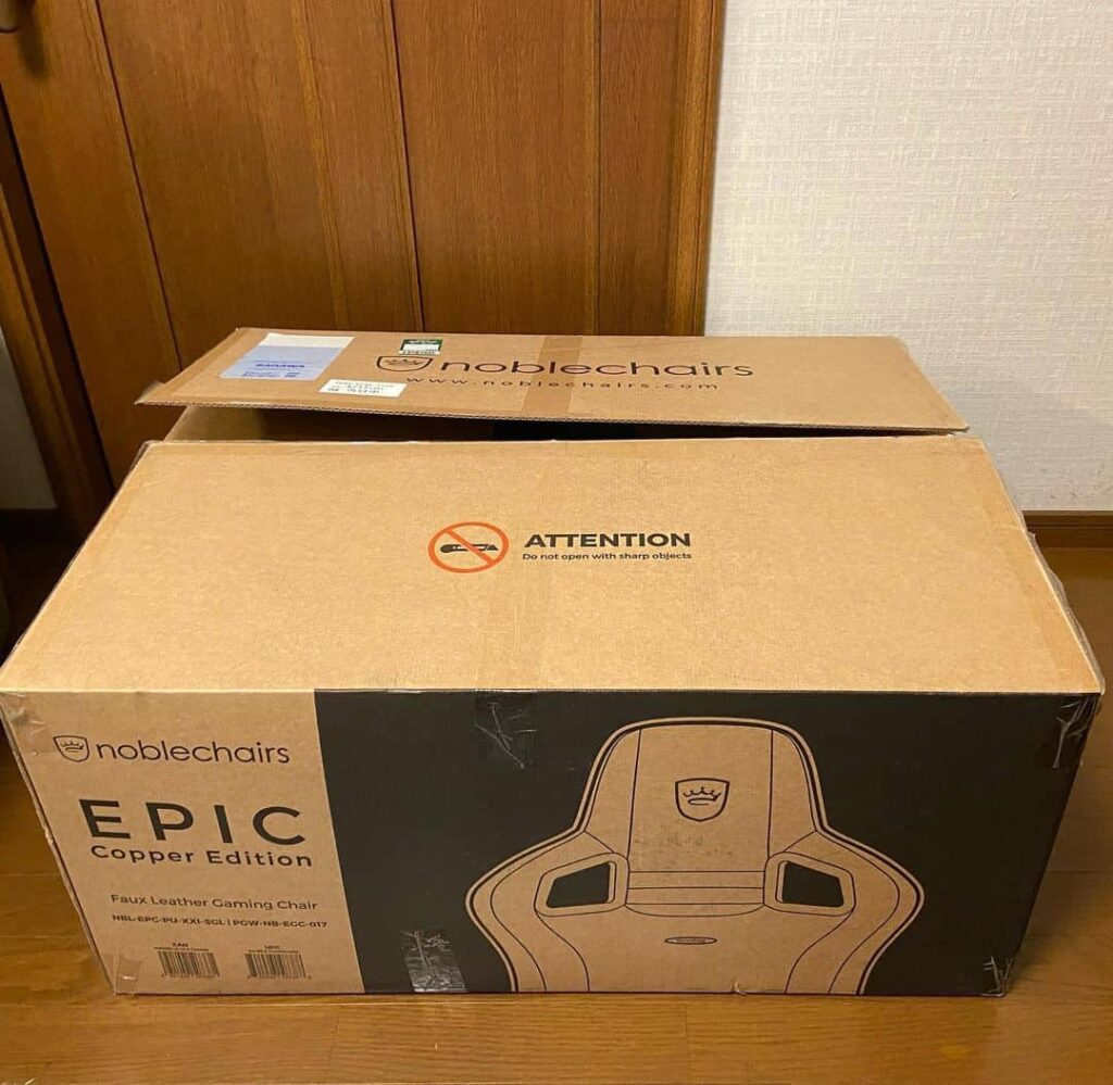view of noblechairs epic unboxing purchased package arrival home next to door